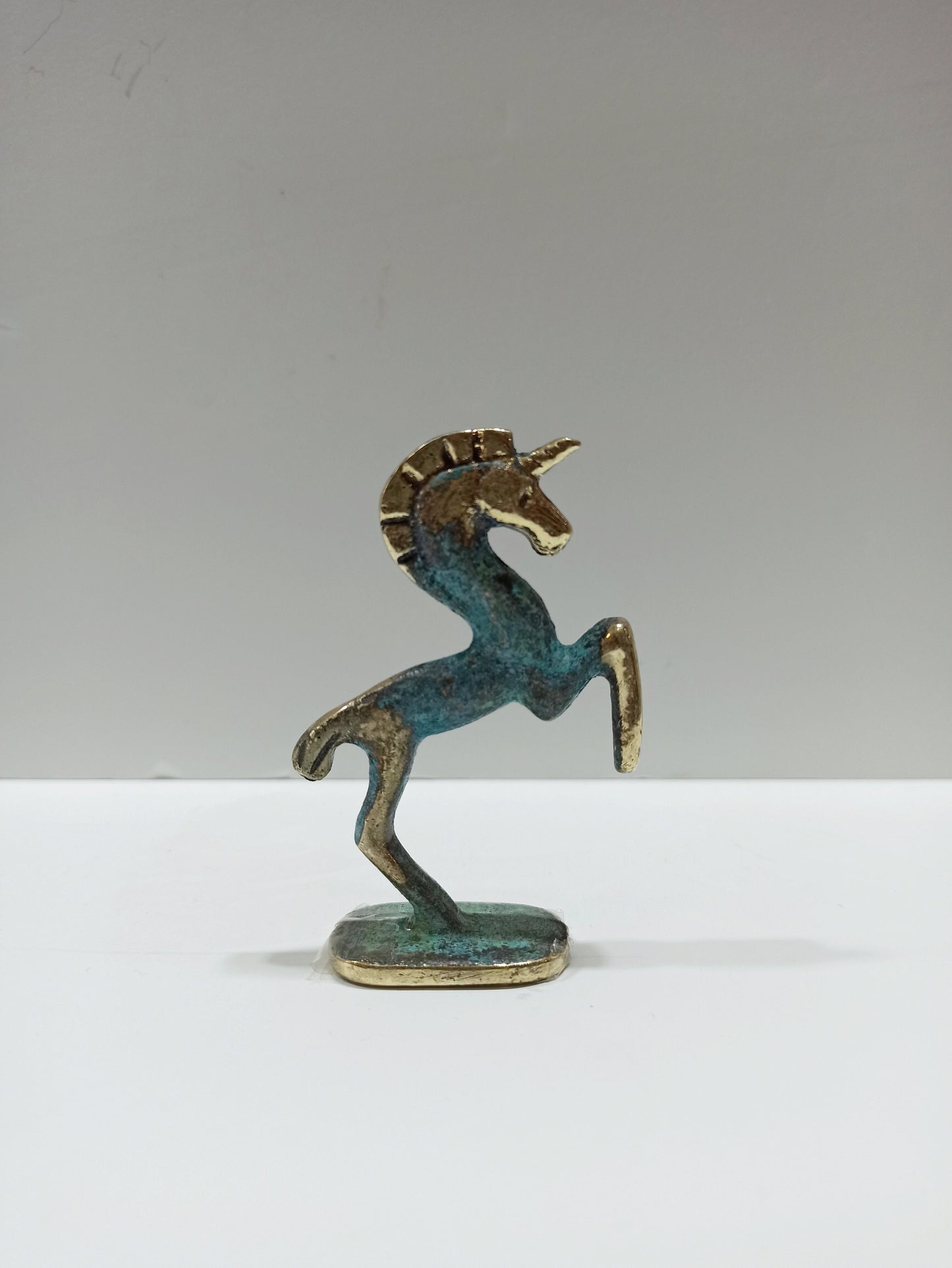 Unicorn - Legendary Creature with a single large, pointed, spiraling Horn projecting from its Forehead - Pure Bronze Sculpture