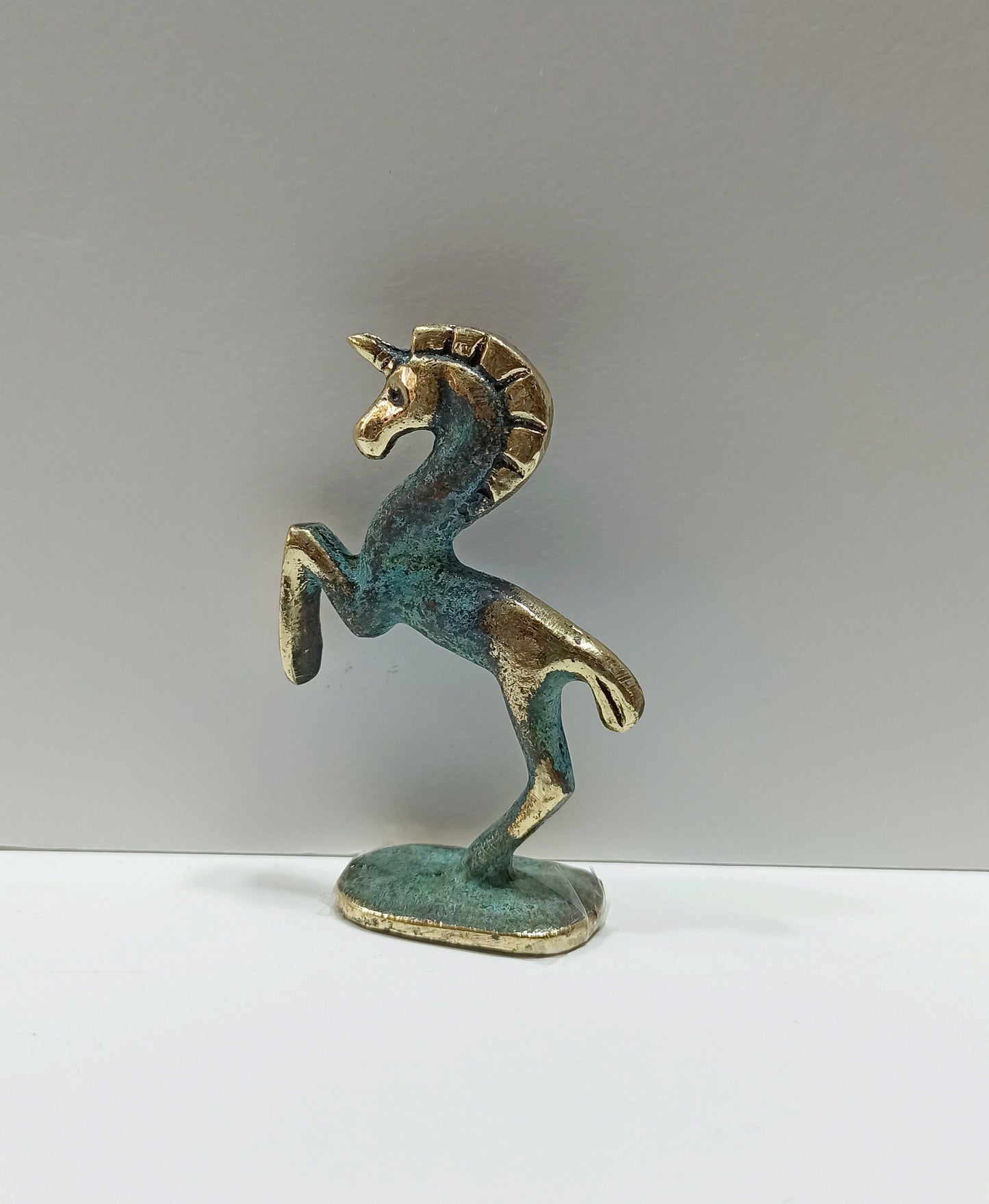 Unicorn - Legendary Creature with a single large, pointed, spiraling Horn projecting from its Forehead - Pure Bronze Sculpture