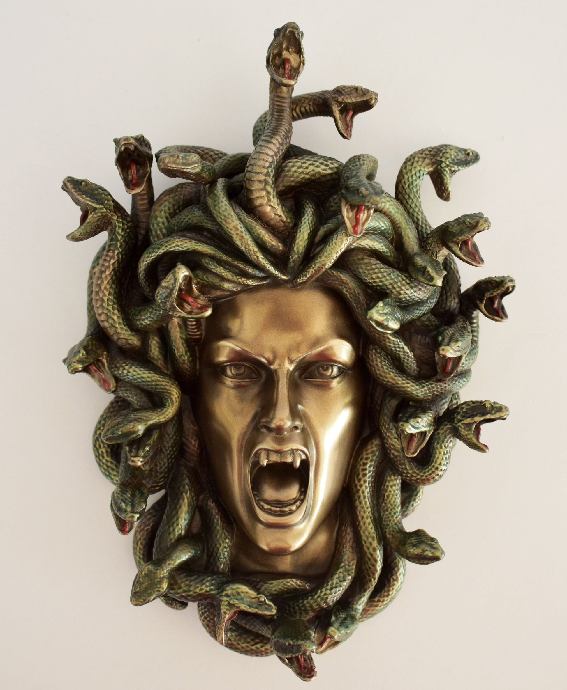 Medusa, Gorgo, greek alabaster statue in gold tone, the mythical creature